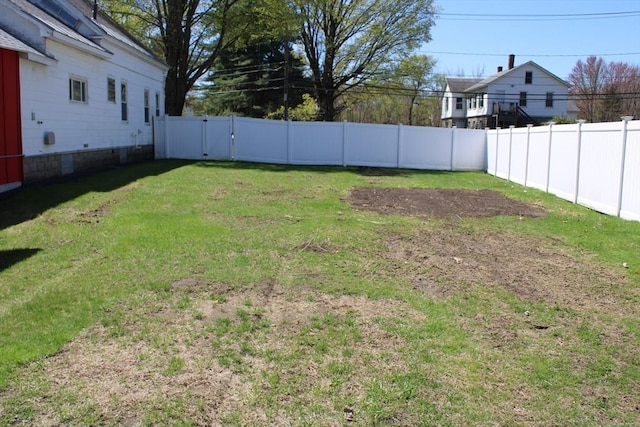 view of yard with a fenced backyard