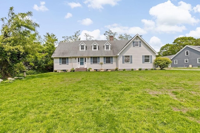 3 Plymouth Heights Rd, Bourne, MA 02562 - view of front of property with a chimney and a front lawn