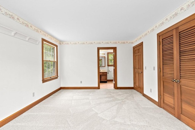 3 Plymouth Heights Rd, Bourne, MA 02562 - unfurnished bedroom featuring baseboards, multiple windows, a closet, and light colored carpet