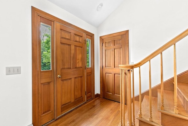 3 Plymouth Heights Rd, Bourne, MA 02562 - entryway featuring light wood-type flooring, vaulted ceiling, and stairs