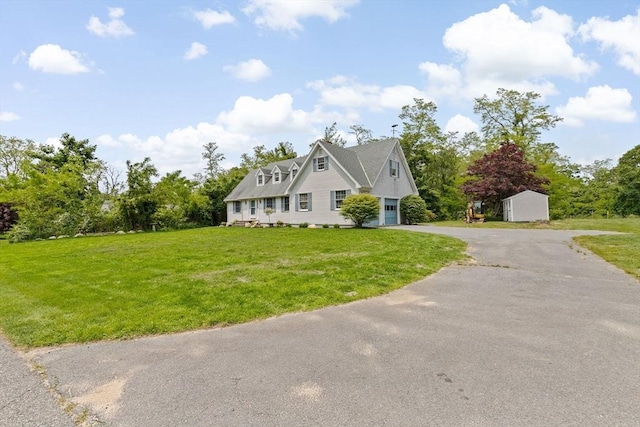 3 Plymouth Heights Rd, Bourne, MA 02562 - view of front of property with driveway, an attached garage, and a front yard