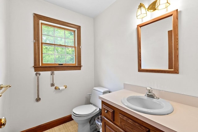 3 Plymouth Heights Rd, Bourne, MA 02562 - half bathroom featuring toilet, vanity, baseboards, and tile patterned floors
