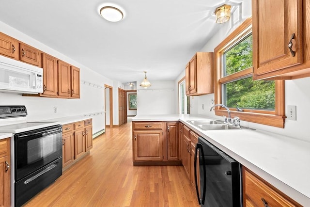 3 Plymouth Heights Rd, Bourne, MA 02562 - kitchen with white microwave, black electric range oven, dishwasher, a sink, and a baseboard heating unit