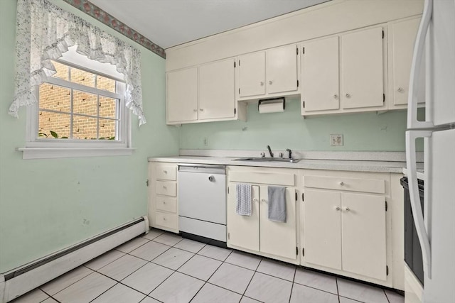 253 Rock St Unit 253, Norwood, MA 02062 - kitchen featuring white appliances, baseboard heating, light countertops, and white cabinetry