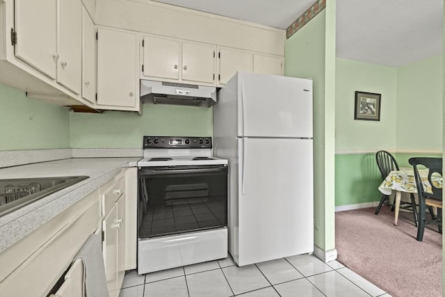 253 Rock St Unit 253, Norwood, MA 02062 - kitchen featuring white appliances, under cabinet range hood, light countertops, white cabinets, and light tile patterned floors