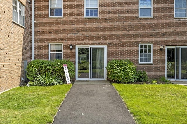 253 Rock St Unit 253, Norwood, MA 02062 - entrance to property with a yard and brick siding