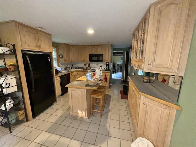 270 Pine St, Marshfield, MA 02050 - kitchen featuring black appliances, a kitchen island, light tile patterned floors, glass insert cabinets, and a kitchen breakfast bar