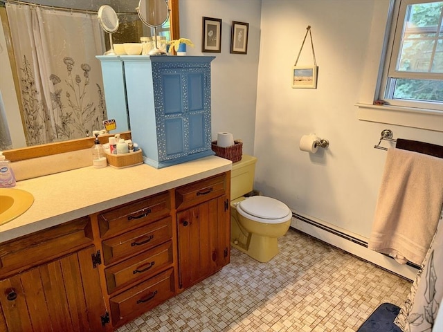 270 Pine St, Marshfield, MA 02050 - full bath with a baseboard radiator, toilet, vanity, and tile patterned floors