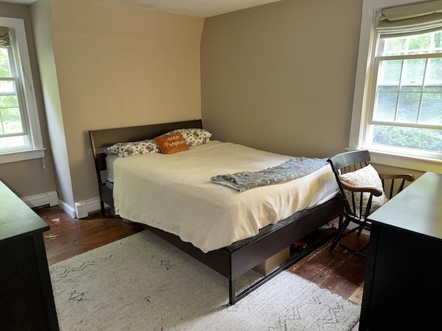 270 Pine St, Marshfield, MA 02050 - bedroom featuring dark wood-style flooring, a baseboard heating unit, and baseboards