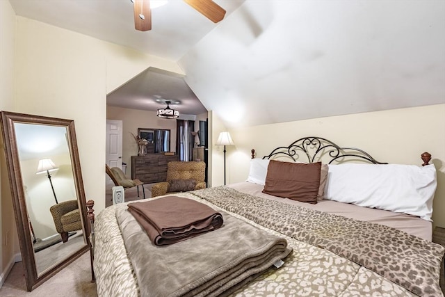 carpeted bedroom with vaulted ceiling and ceiling fan