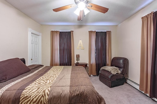 carpeted bedroom with ceiling fan and a textured ceiling