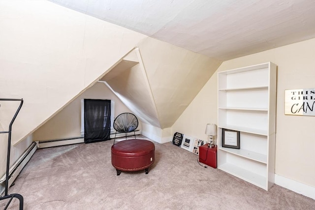 sitting room featuring vaulted ceiling, light colored carpet, and baseboard heating