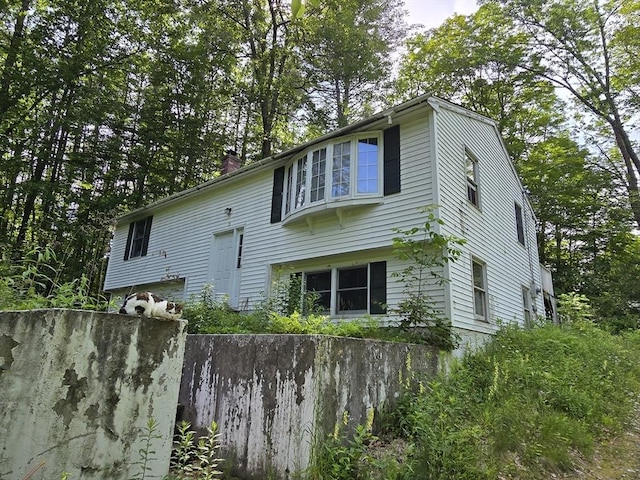 35 Beacon St, Orange, MA 01364 - view of side of home featuring a chimney