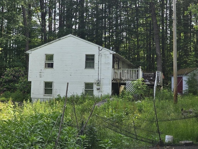 35 Beacon St, Orange, MA 01364 - view of property exterior with a storage unit and a deck