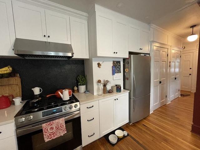 75 Rossmore Rd Unit 5, Boston, MA 02130 - kitchen with stainless steel appliances, ventilation hood, light wood-type flooring, white cabinetry, and light countertops