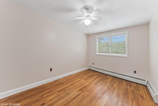 591 Poplar St, Boston, MA 02131 - empty room with light wood-type flooring, a baseboard radiator, baseboards, a ceiling fan, and a textured ceiling