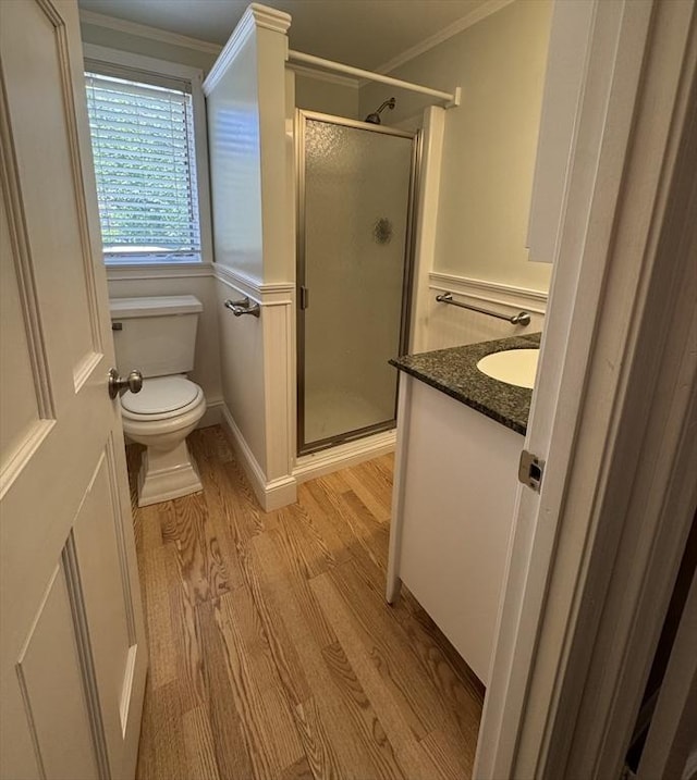 591 Poplar St, Boston, MA 02131 - full bathroom featuring wood finished floors, a stall shower, toilet, vanity, and crown molding