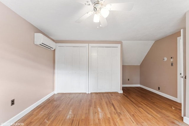591 Poplar St, Boston, MA 02131 - bonus room featuring a wall unit AC, baseboards, light wood-type flooring, a ceiling fan, and lofted ceiling
