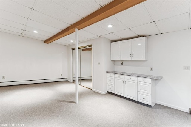 591 Poplar St, Boston, MA 02131 - finished basement featuring baseboard heating, recessed lighting, light carpet, a drop ceiling, and baseboards