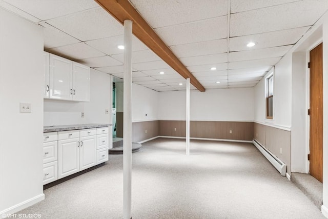 591 Poplar St, Boston, MA 02131 - below grade area with baseboard heating, light carpet, a paneled ceiling, recessed lighting, and wainscoting