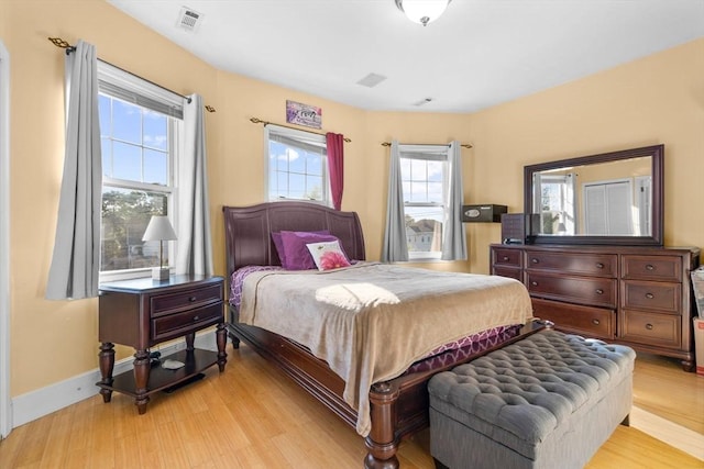 41 Standish St Unit 3, Boston, MA 02124 - bedroom featuring multiple windows, light wood-style floors, and baseboards