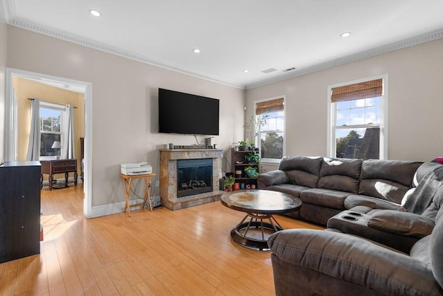 41 Standish St Unit 3, Boston, MA 02124 - living room featuring ornamental molding, light wood-style flooring, recessed lighting, a glass covered fireplace, and baseboards