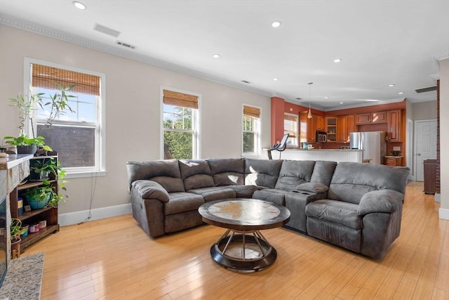 41 Standish St Unit 3, Boston, MA 02124 - living room featuring plenty of natural light, baseboards, recessed lighting, light wood-style flooring, and ornamental molding