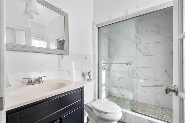 41 Standish St Unit 3, Boston, MA 02124 - full bathroom with toilet, a shower stall, vanity, and tile walls