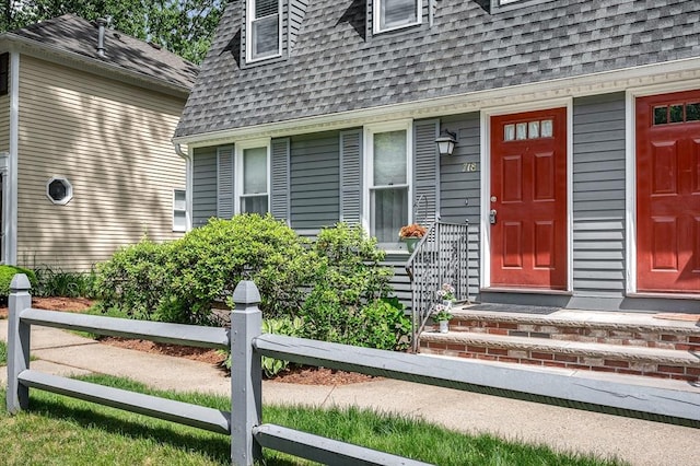 718 Wellman Ave Unit 718, Chelmsford, MA 01863 - property entrance with roof with shingles