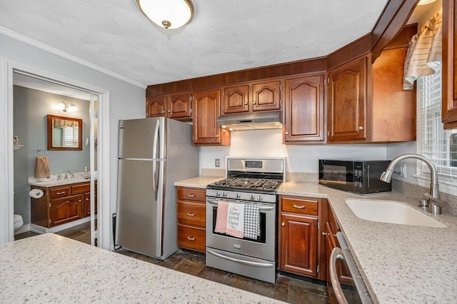 718 Wellman Ave Unit 718, Chelmsford, MA 01863 - kitchen featuring stainless steel appliances, under cabinet range hood, a sink, light countertops, and ornamental molding