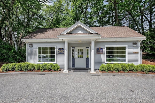 718 Wellman Ave Unit 718, Chelmsford, MA 01863 - view of front of home featuring roof with shingles