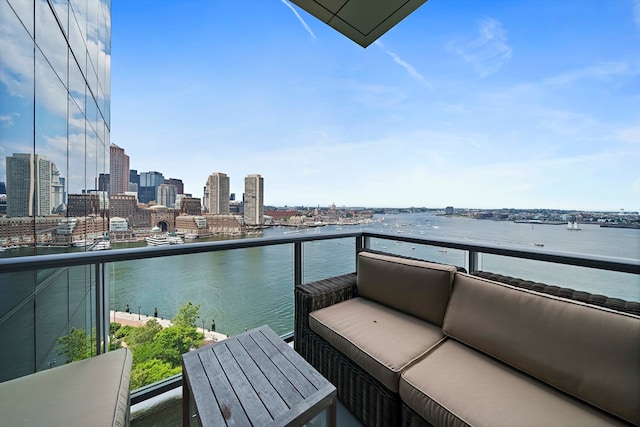 balcony featuring a water view