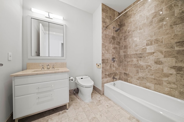 full bathroom with tile floors, toilet, vanity, and tiled shower / bath