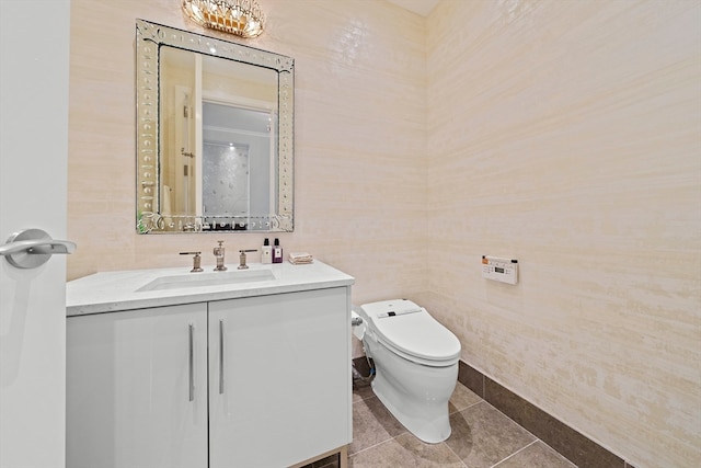 bathroom featuring tile walls, toilet, tile floors, and vanity with extensive cabinet space