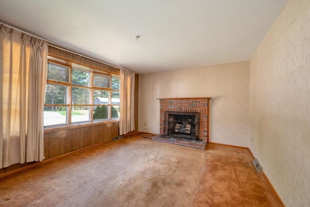 unfurnished living room featuring visible vents and carpet