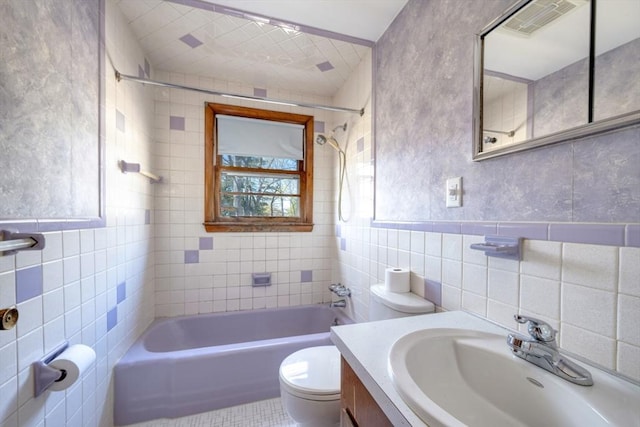 bathroom featuring visible vents, toilet, tile walls, tile patterned floors, and shower / bath combination
