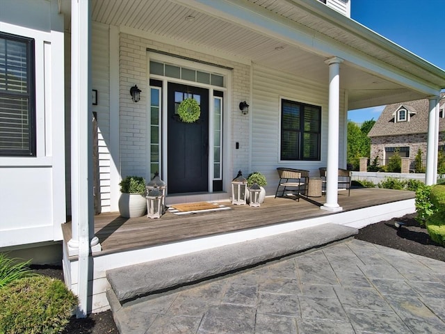 50 Bentley Ln, Westport, MA 02790 - property entrance featuring covered porch and brick siding