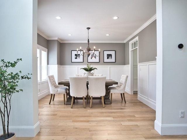 50 Bentley Ln, Westport, MA 02790 - dining area with a chandelier, a decorative wall, recessed lighting, a wainscoted wall, and light wood-style flooring