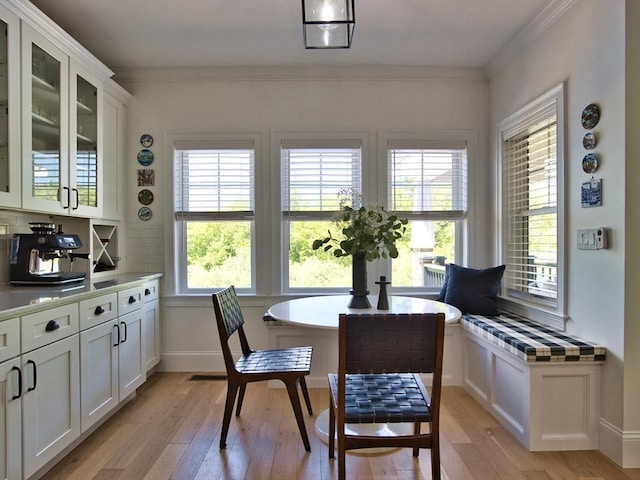 50 Bentley Ln, Westport, MA 02790 - dining area with light wood finished floors, ornamental molding, and baseboards