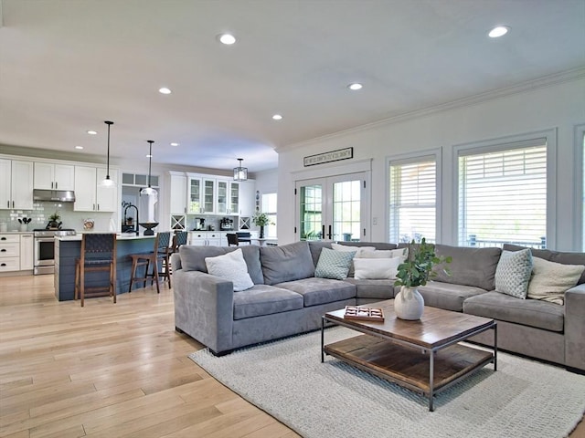 50 Bentley Ln, Westport, MA 02790 - living room featuring crown molding, recessed lighting, and light wood-style flooring
