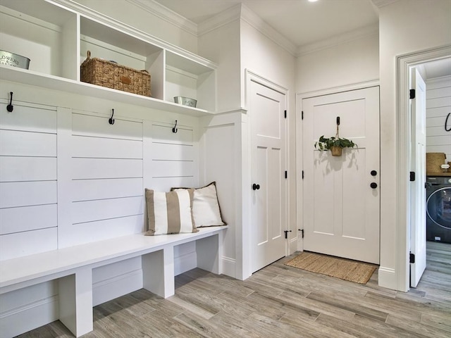 50 Bentley Ln, Westport, MA 02790 - mudroom featuring washer / dryer, light wood finished floors, crown molding, and baseboards