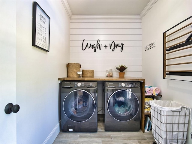 50 Bentley Ln, Westport, MA 02790 - laundry room featuring washer and clothes dryer, crown molding, wood finished floors, and baseboards