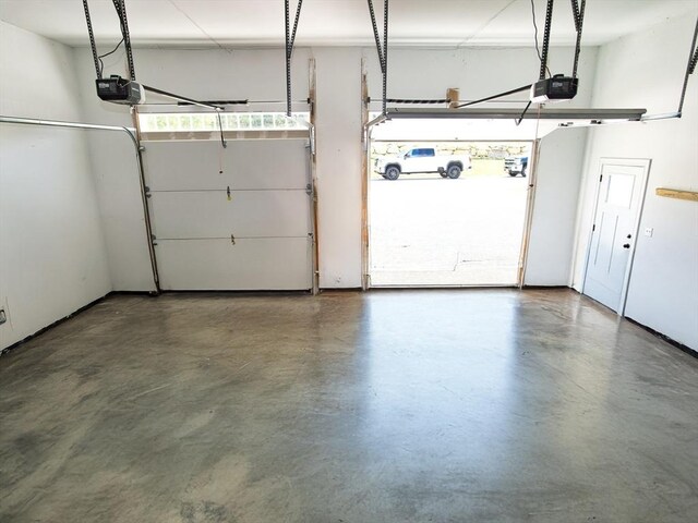 50 Bentley Ln, Westport, MA 02790 - garage featuring a garage door opener