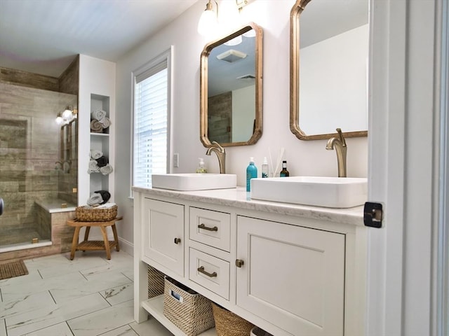 50 Bentley Ln, Westport, MA 02790 - bathroom featuring marble finish floors, a stall shower, and double vanity