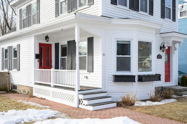 property entrance with covered porch