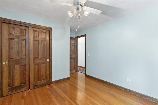 unfurnished bedroom featuring ceiling fan and light hardwood / wood-style floors