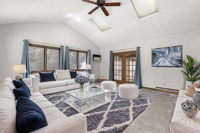 living room featuring a wall mounted air conditioner, high vaulted ceiling, french doors, and a healthy amount of sunlight