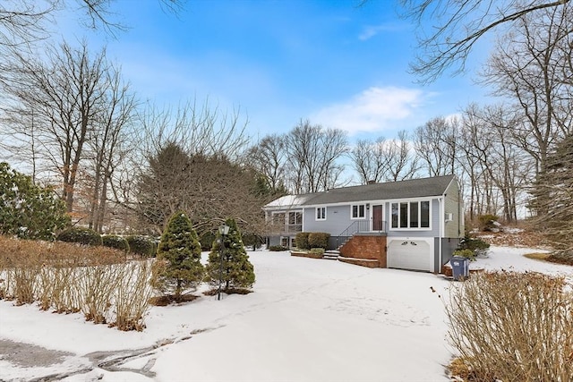 view of front of property with a garage