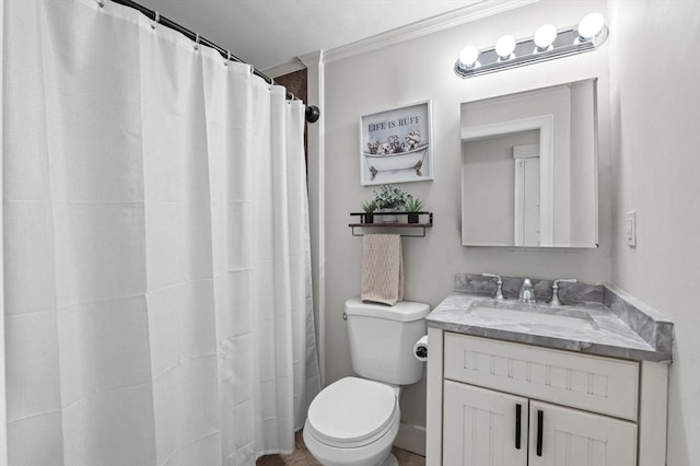 bathroom with vanity, ornamental molding, and toilet