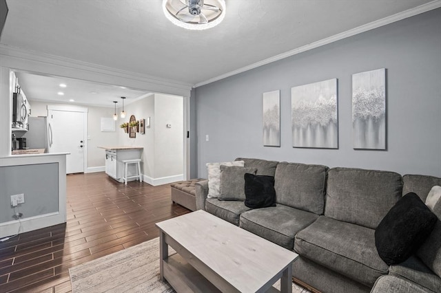 living room featuring ornamental molding and dark hardwood / wood-style flooring